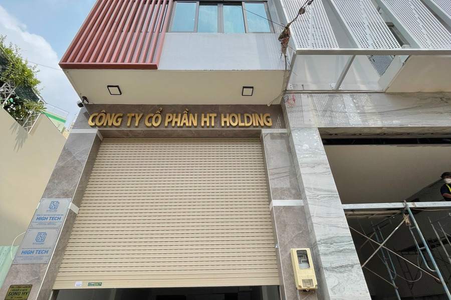 Tòa nhà căn hộ dịch vụ đường Nguyễn Văn Trỗi 5 lầu thang máy, 11 phong ngủ full nội thất-01